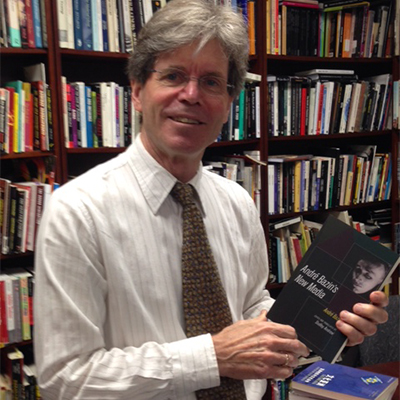 Professor Dudley Andrew holding his new publication, a collection of Andre Bazin's essays